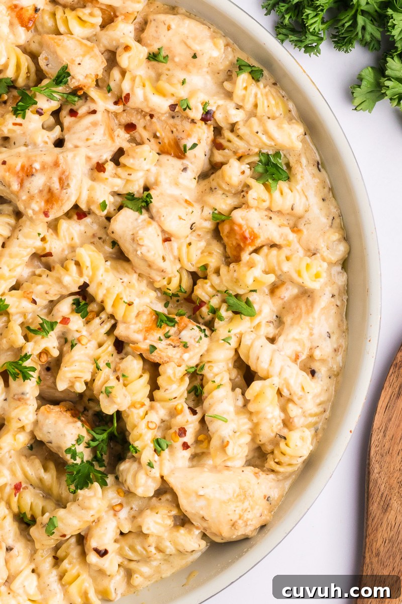 Chicken garlic parmesan pasta in a white bowl, ready to be served.