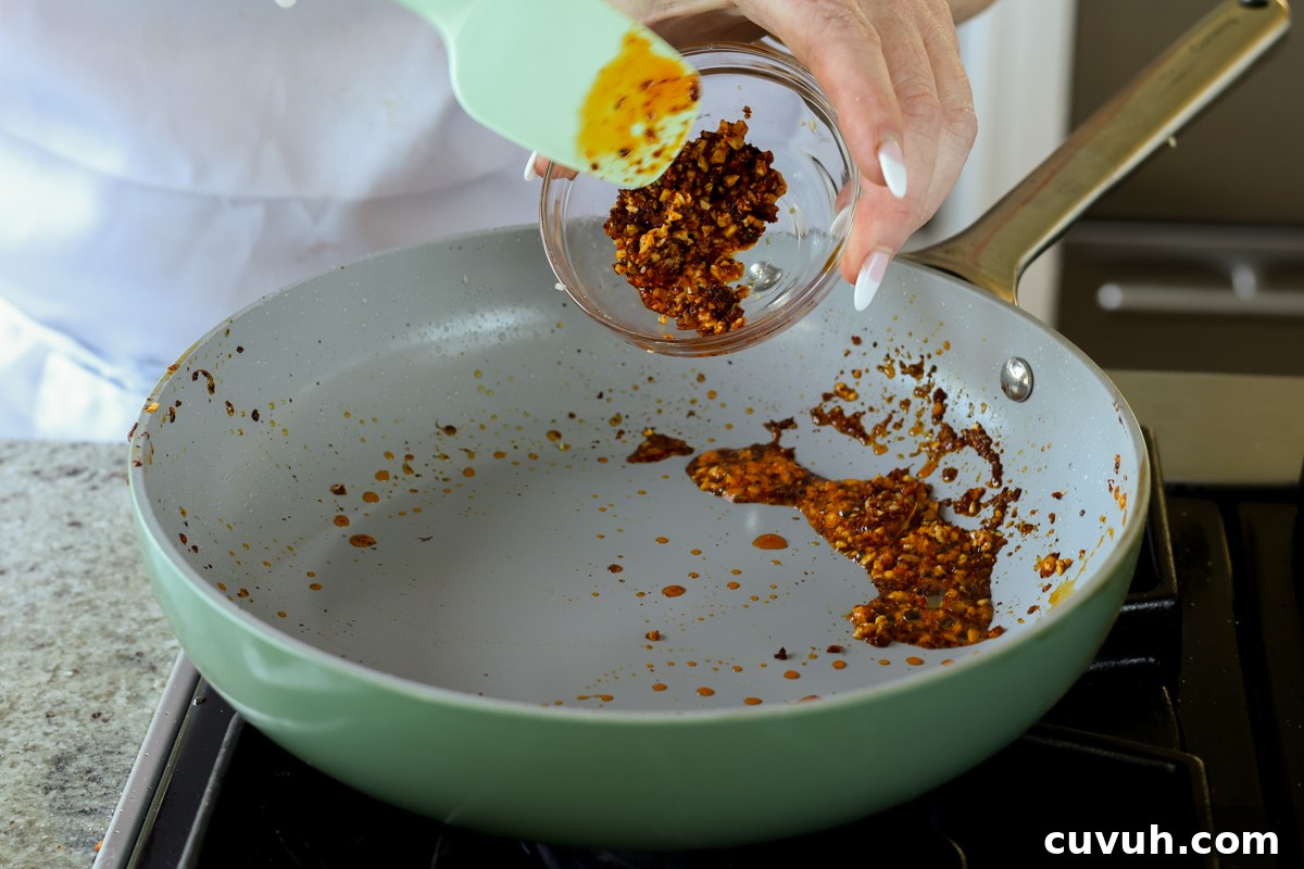 Creamy Tahini Ramen with Teriyaki Tofu (Nut-Free, One-Pan) 14 reserving half of the cooked chili crisp