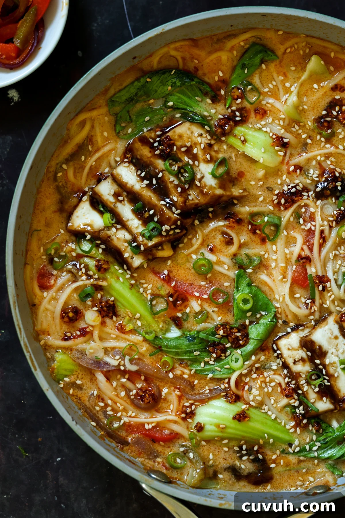 Creamy Tahini Ramen with Teriyaki Tofu (Nut-Free, One-Pan) 4 close-up of a panful of creamy tahini ramen with teriyaki tofu on top