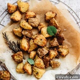 Extra crispy roasted potatoes on slightly burnt parchment paper