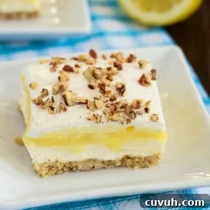 slice of lemon lush dessert on a plate