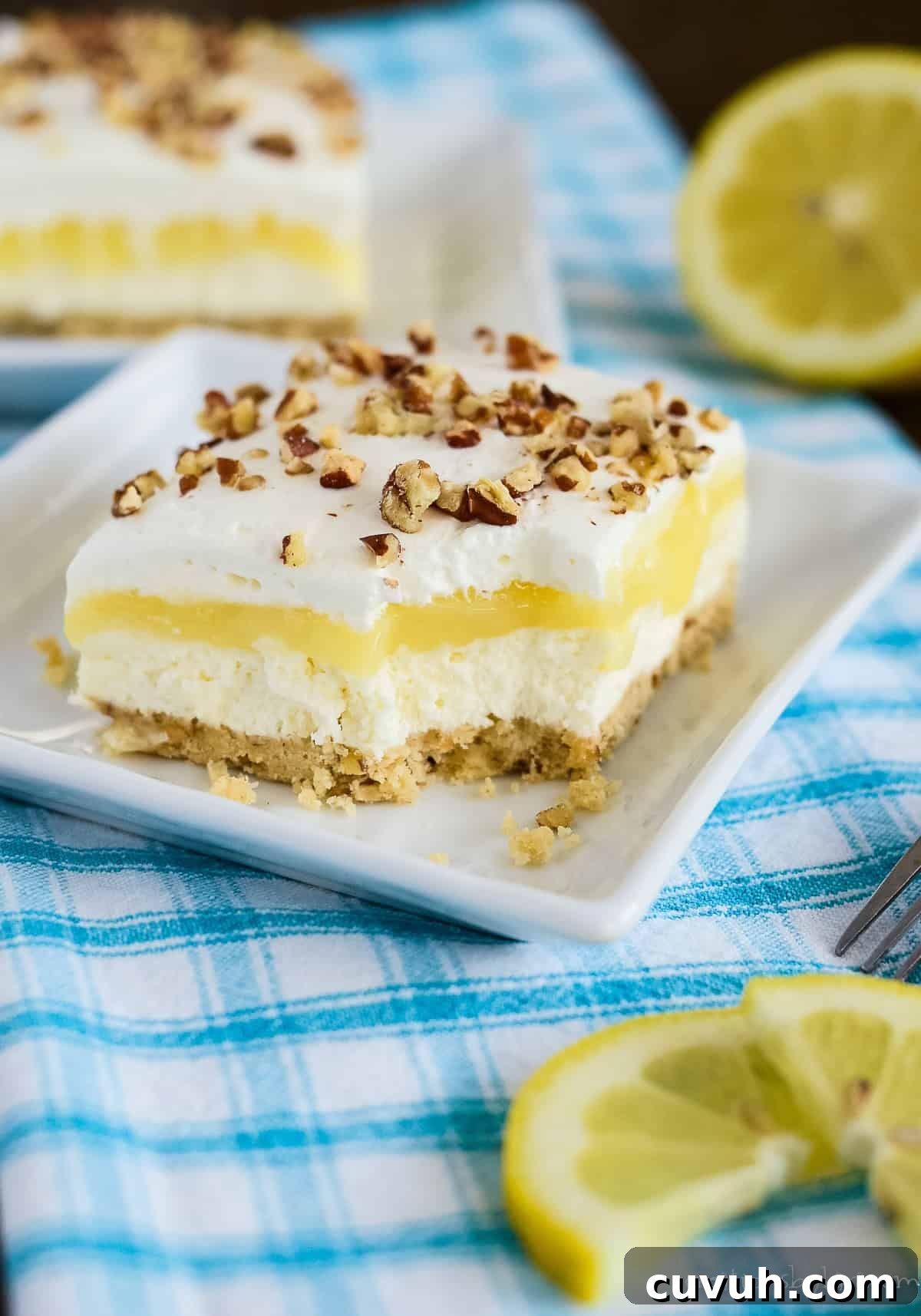 slice of lemon lush with a bite taken out of it