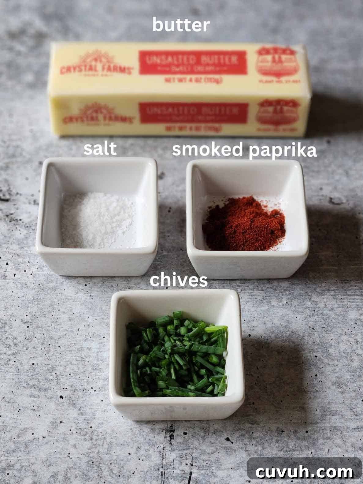 Smoked Chive Butter Recipe: Savory Compound Butter for Bread & Steak 3 Ingredients for chive butter on a grey surface.