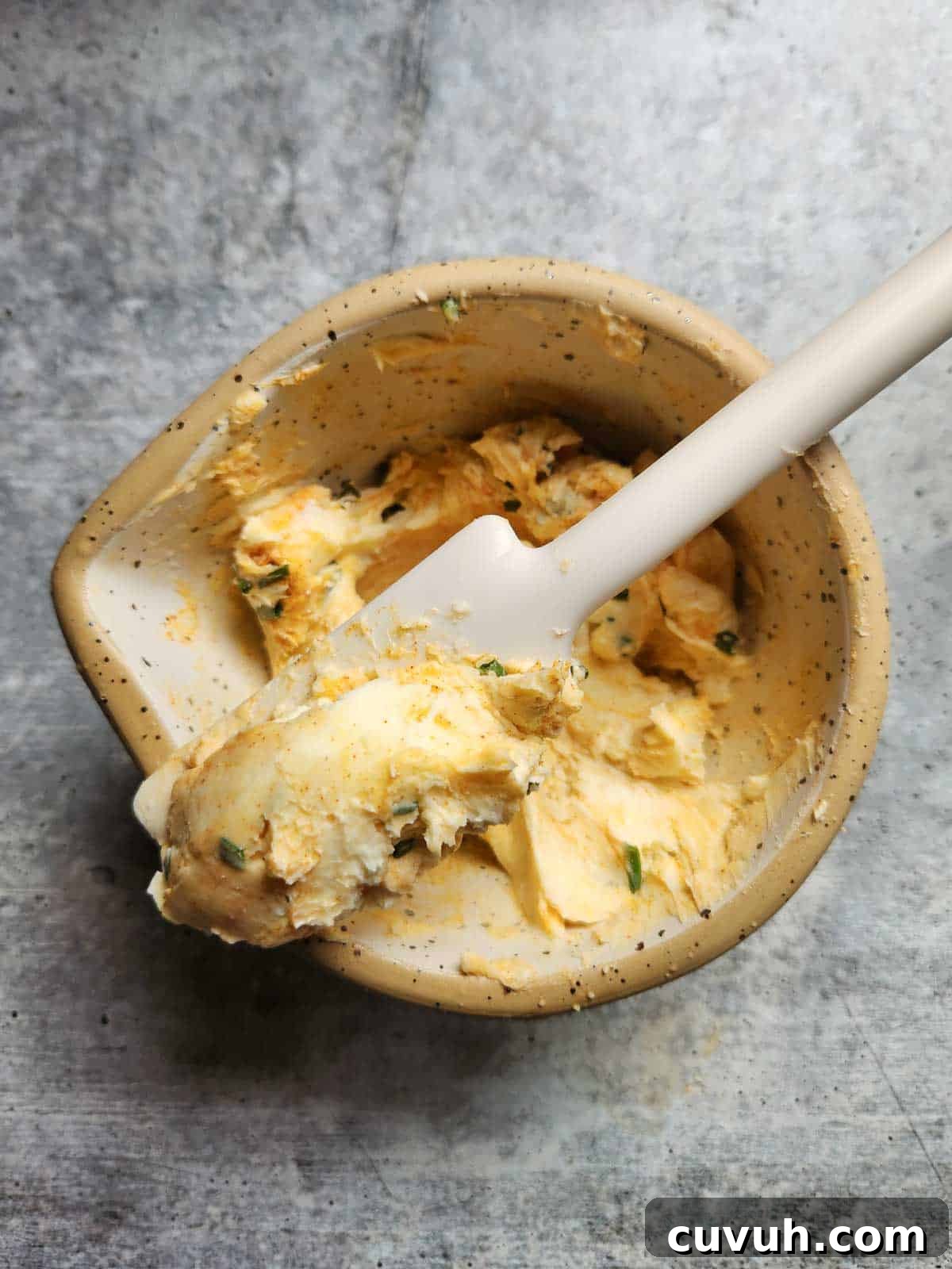 Smoked Chive Butter Recipe: Savory Compound Butter for Bread & Steak 5 Mixed smoked paprika and chive butter in a small bowl.