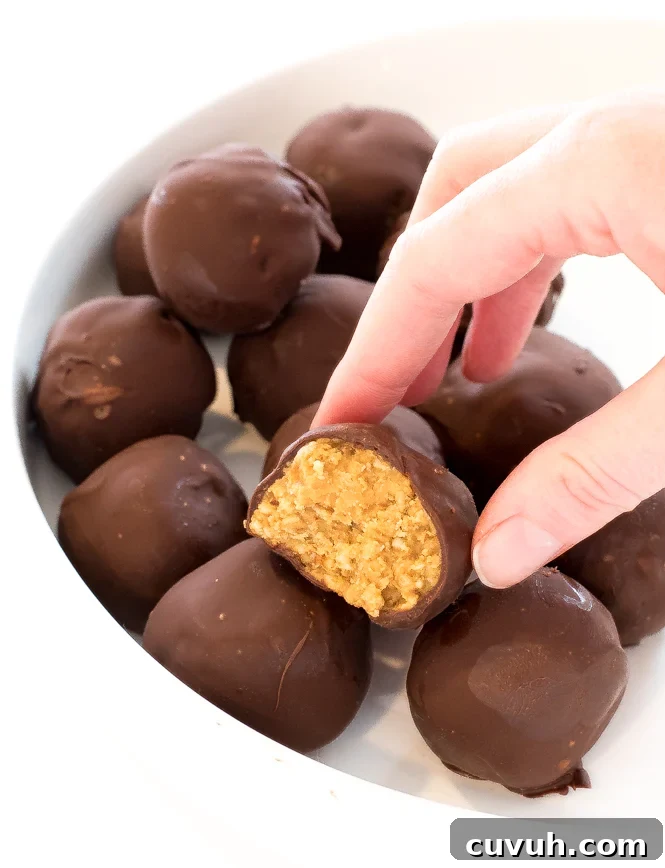 Author picking up a pretzel truffle