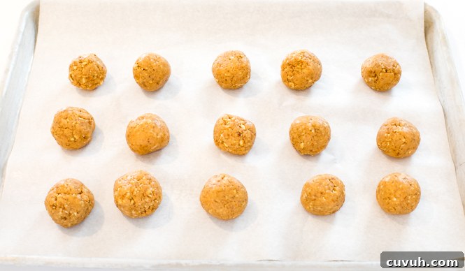 Rolling peanut butter truffles into balls