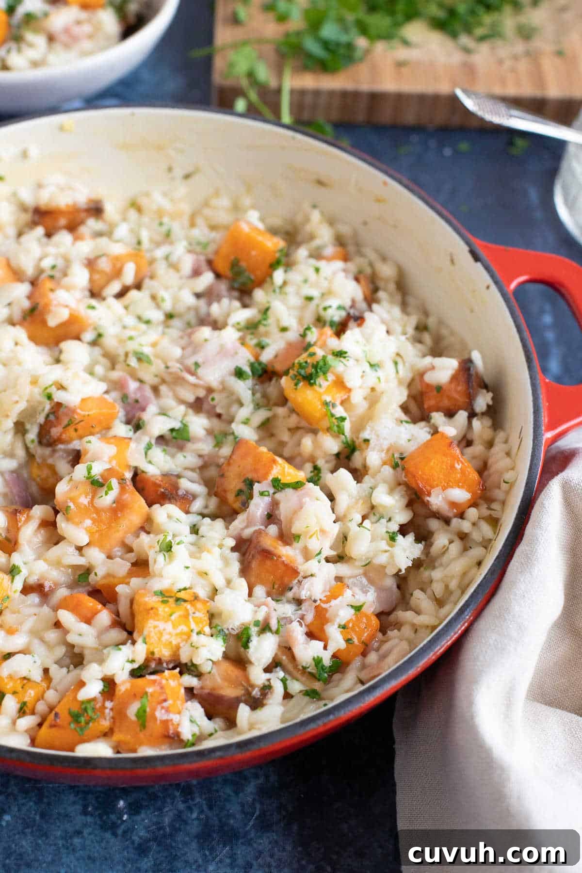 A pan of butternut squash and bacon risotto.
