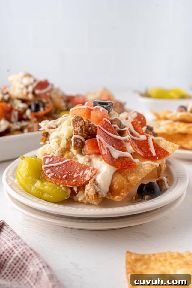 Italian Nachos: Crispy Parmesan Polenta Chips with Tomato-Basil Dip 3 nachos on a plate