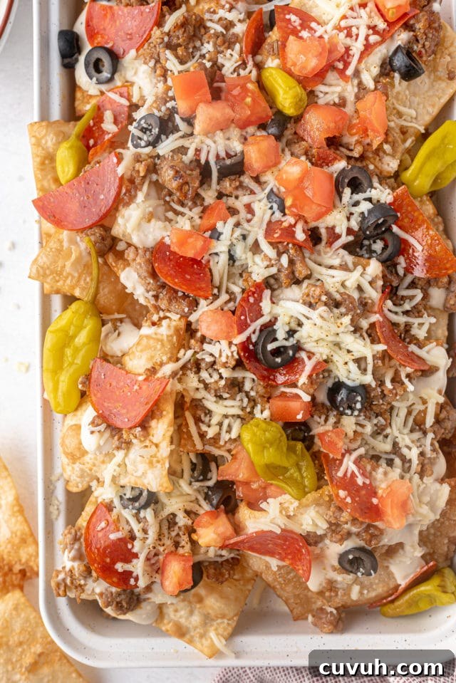 Italian Nachos: Crispy Parmesan Polenta Chips with Tomato-Basil Dip 4 nachos on a baking sheet