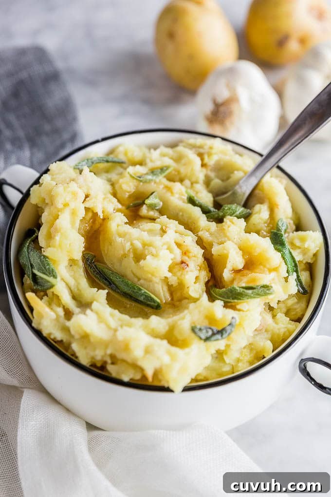 Roasted Garlic Mashed Potatoes with Brown Butter & Sage 3 A bowl of easy roasted garlic mashed potatoes with brown butter and sage.