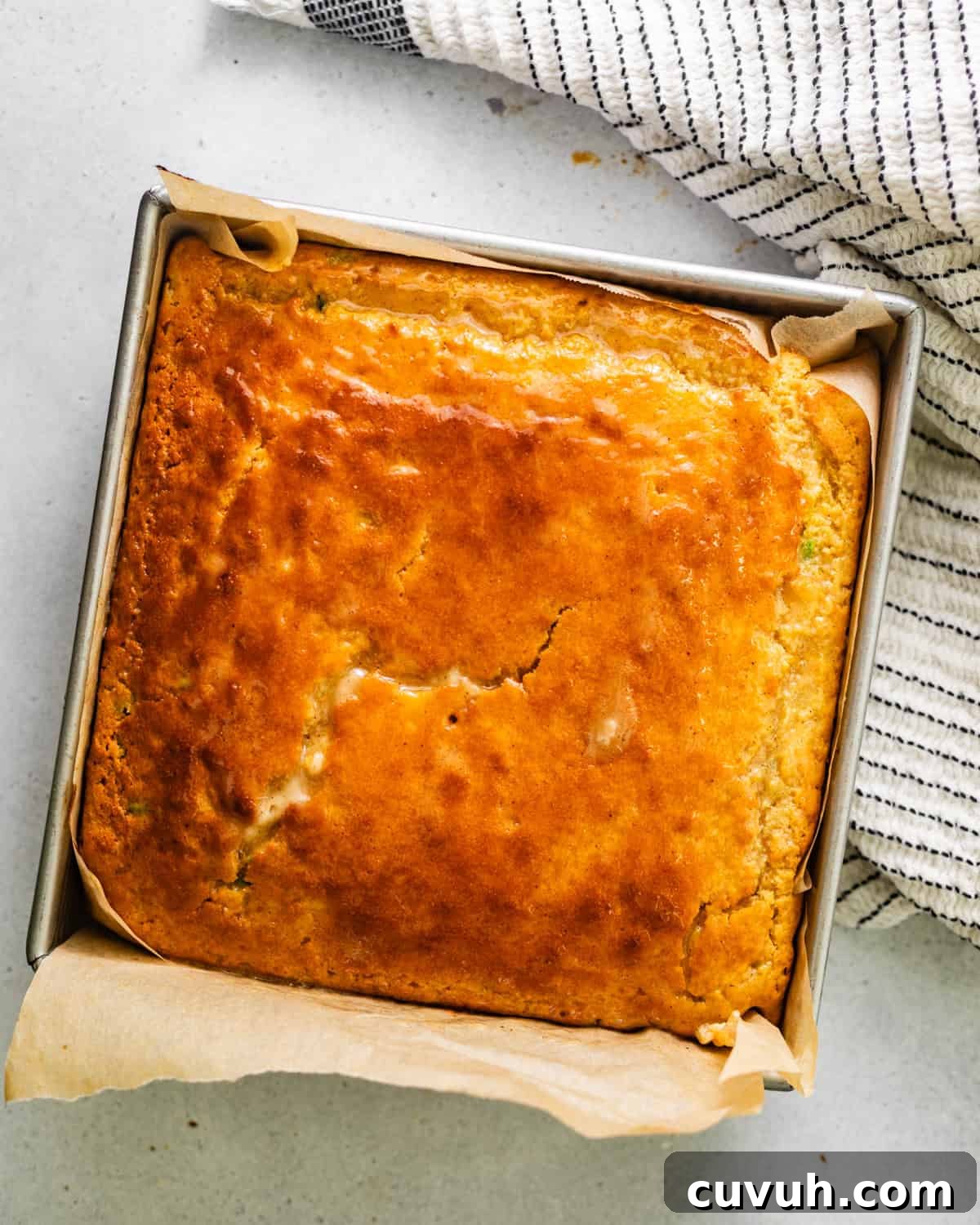 Spicy Jalapeño Honey Cornbread Recipe 8 cornbread with butter brushed on top.