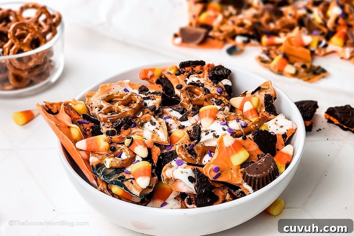 A white bowl full of homemade Halloween bark.