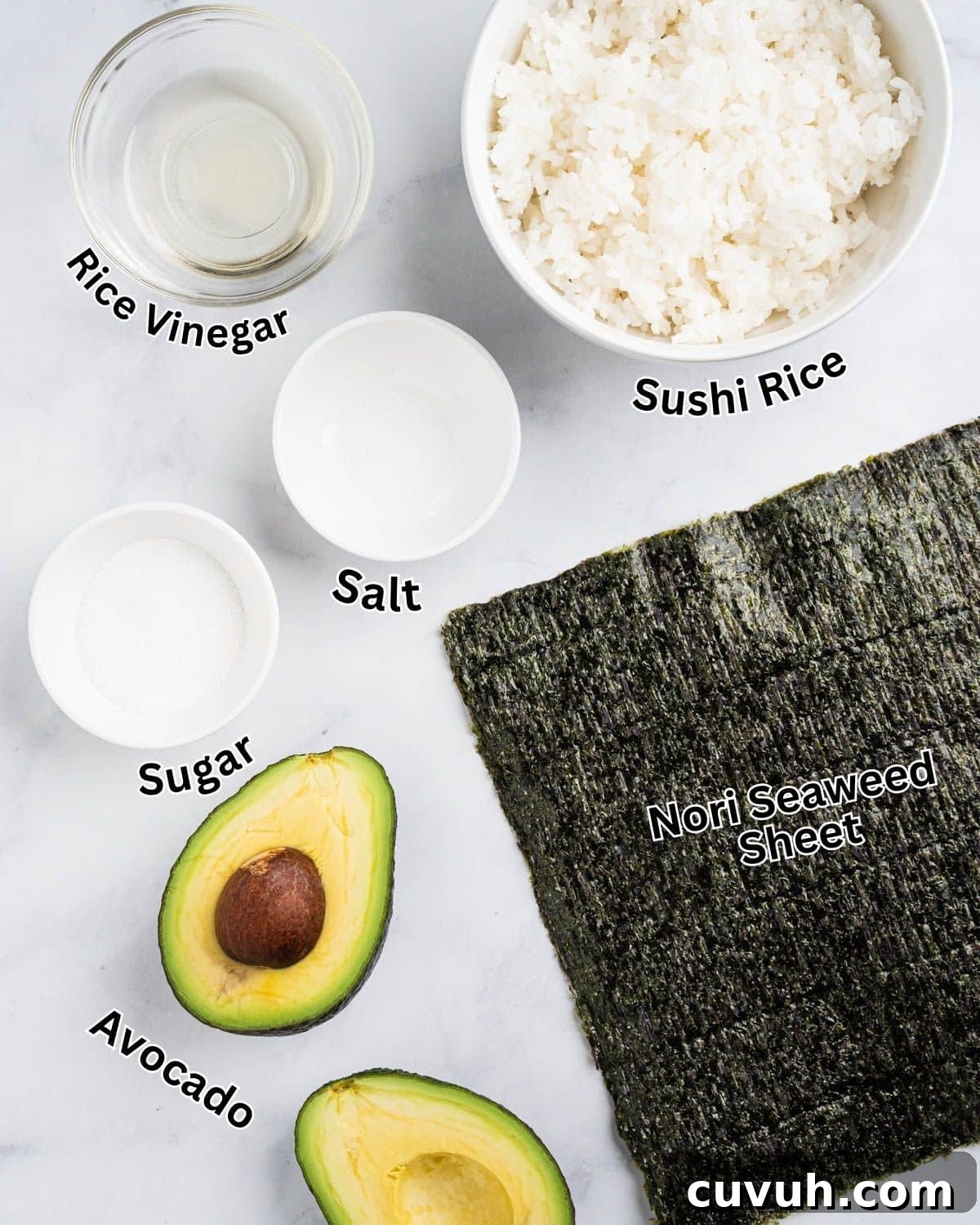 Ingredients needed for avocado roll: nori seaweed sheet, avocado, cooked sushi rice, rice vinegar, sugar, and salt.