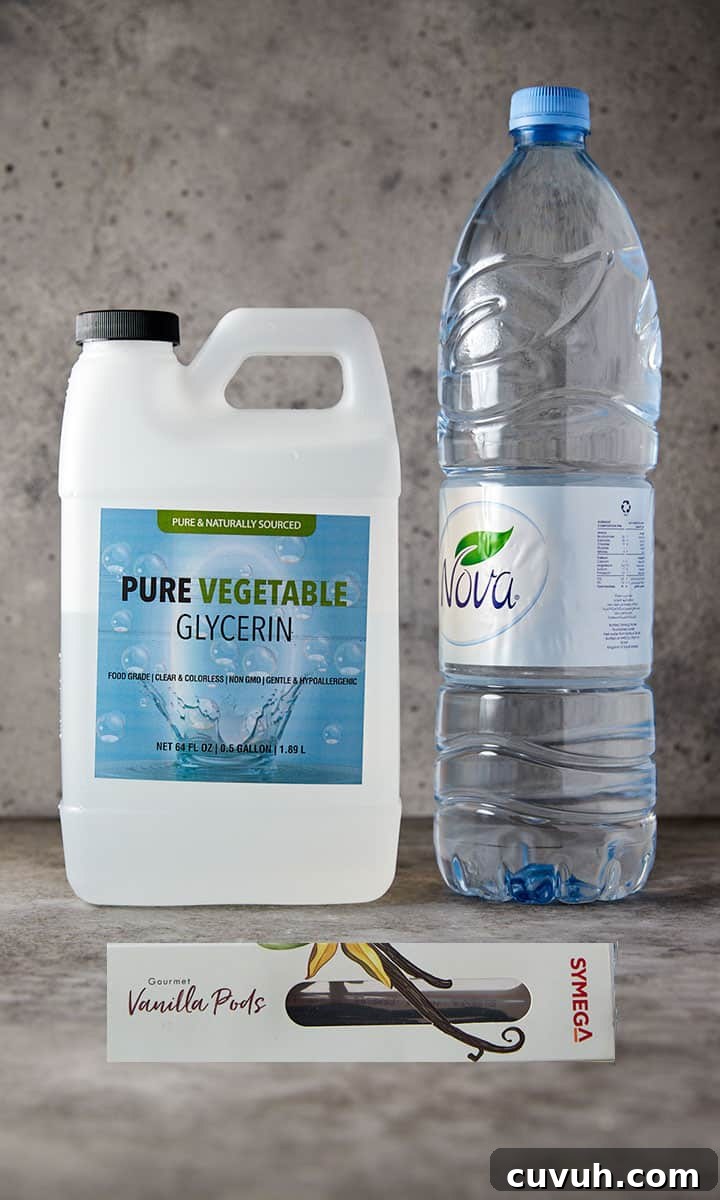 Photo showing the ingredients to make homemade alcohol free vanilla extract - glycerin, water and vanilla pods.