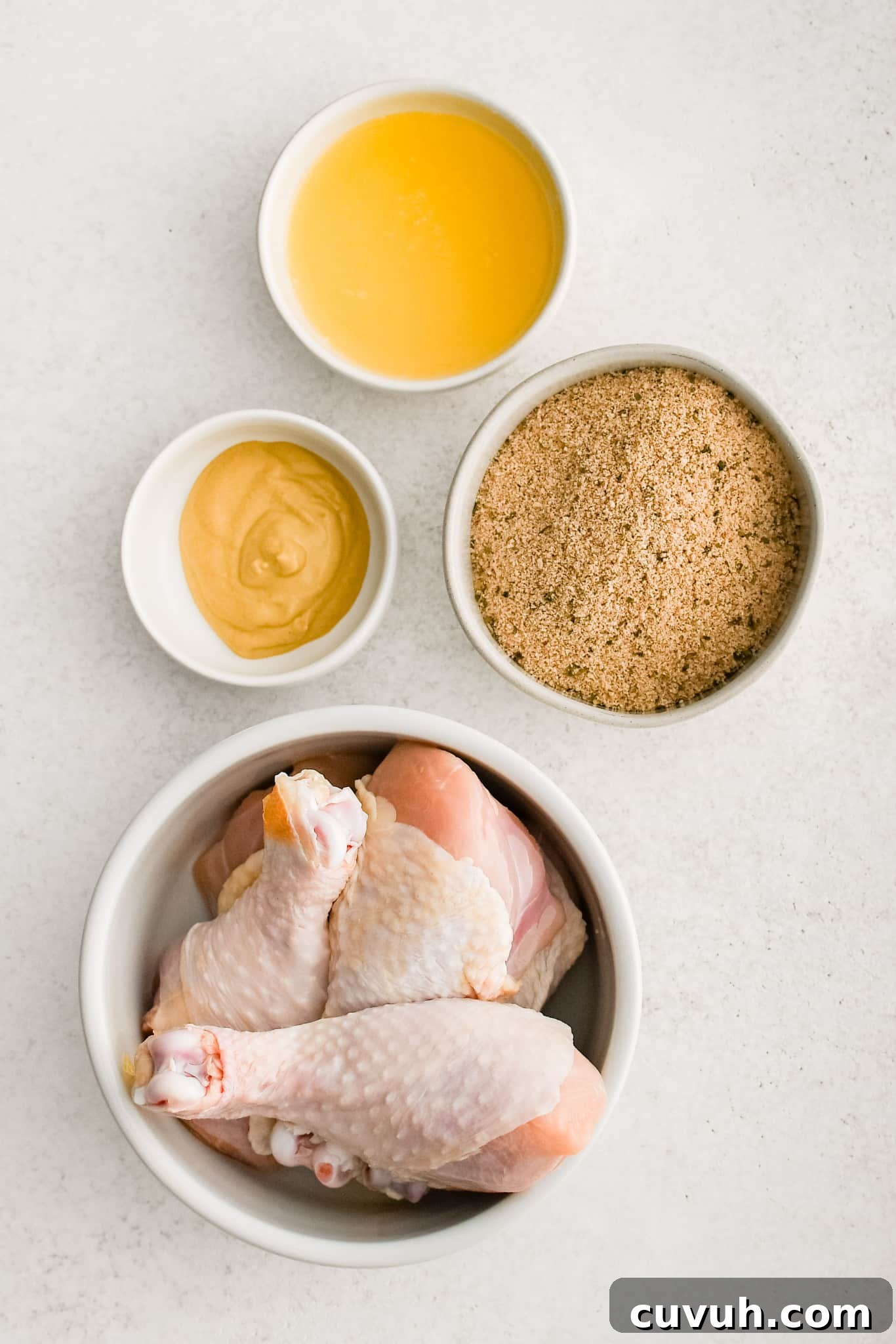 Crispy Shake-and-Bake Chicken Recipe for Perfect Weeknight Meals 4 All of the ingredients needed to make homemade Shake and Bake chicken in individual bowls, measuring cups, and ramekins.