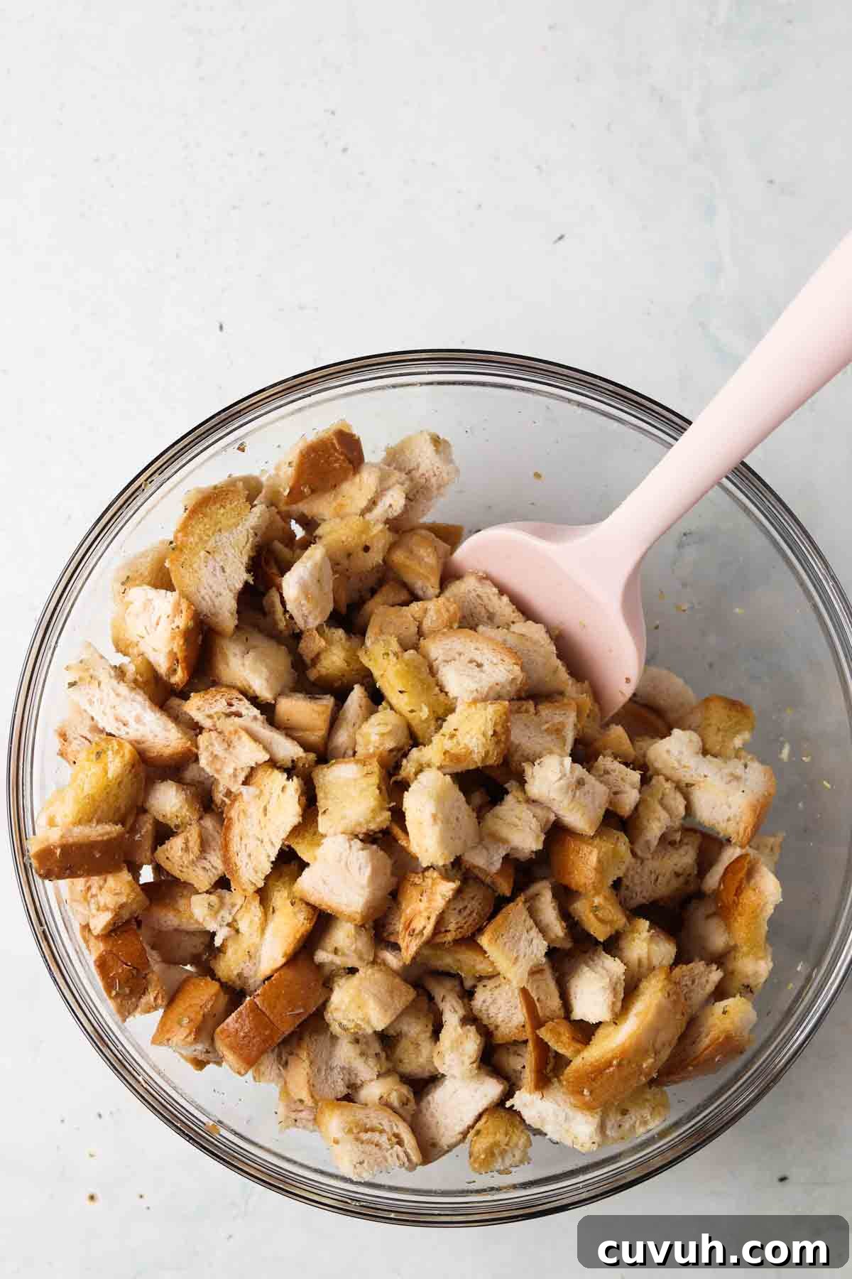 Gluten free croutons ingredients in a glass bowl.