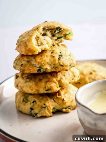 4 aip paleo bread rolls stacked on a plate