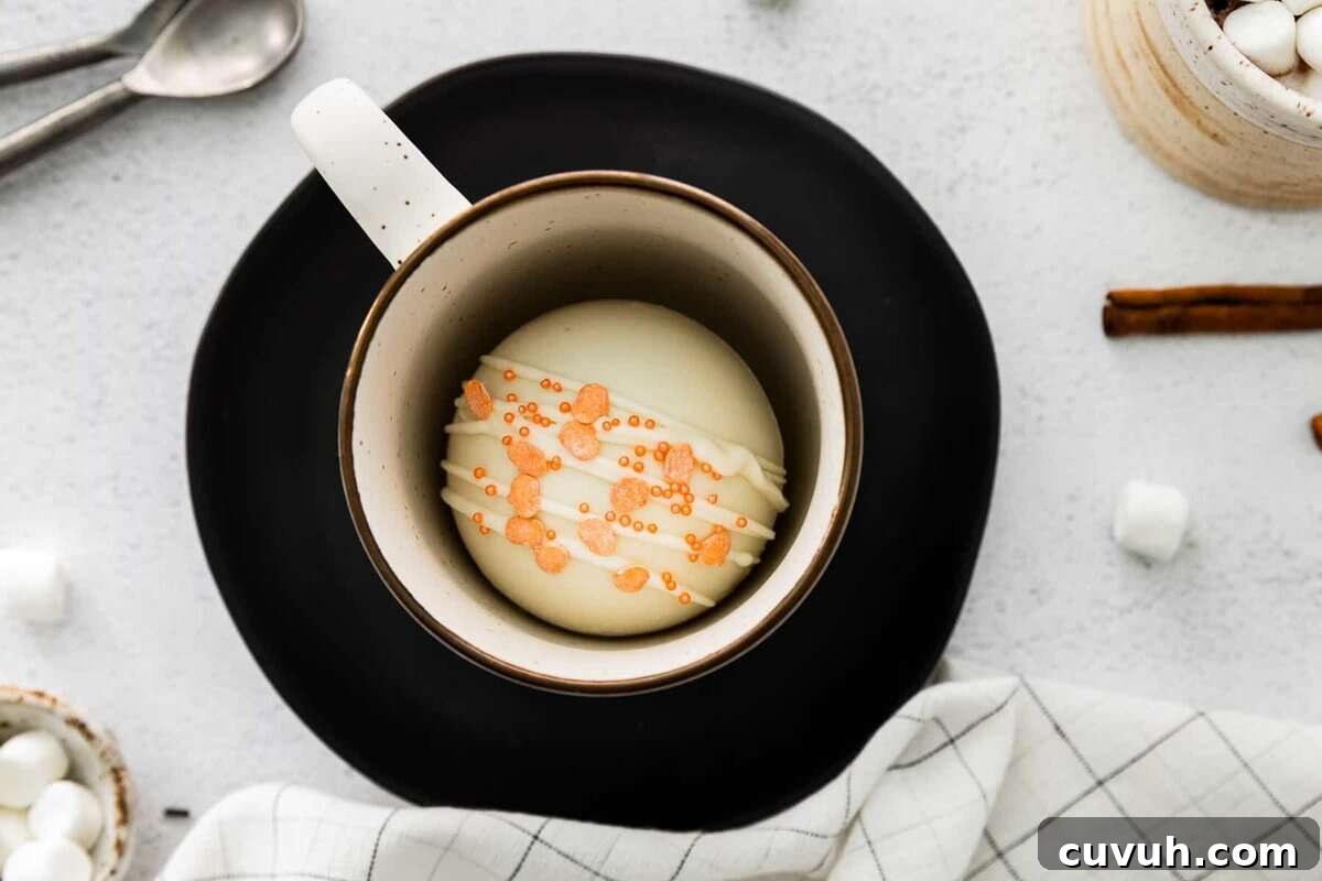 pumpkin spice hot cocoa bomb in mug
