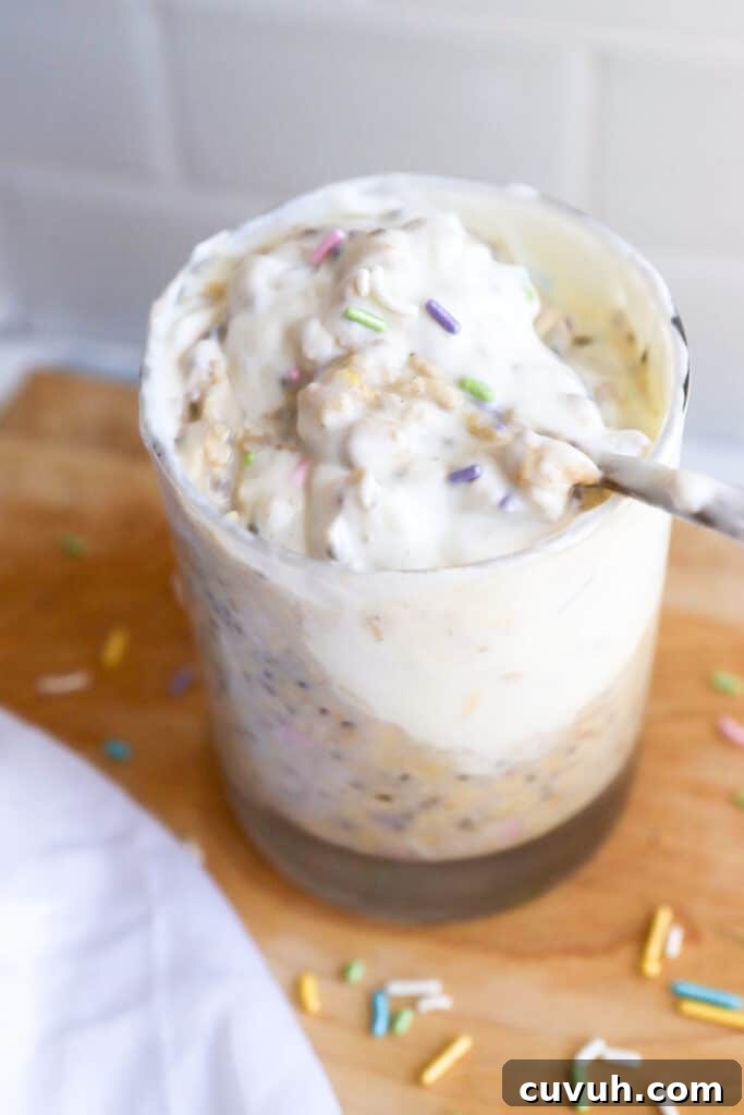 Birthday Cake Overnight Oats — High-Protein Breakfast Recipe 5 a glass of birthday cake overnight oats topped with Greek yogurt and sprinkles