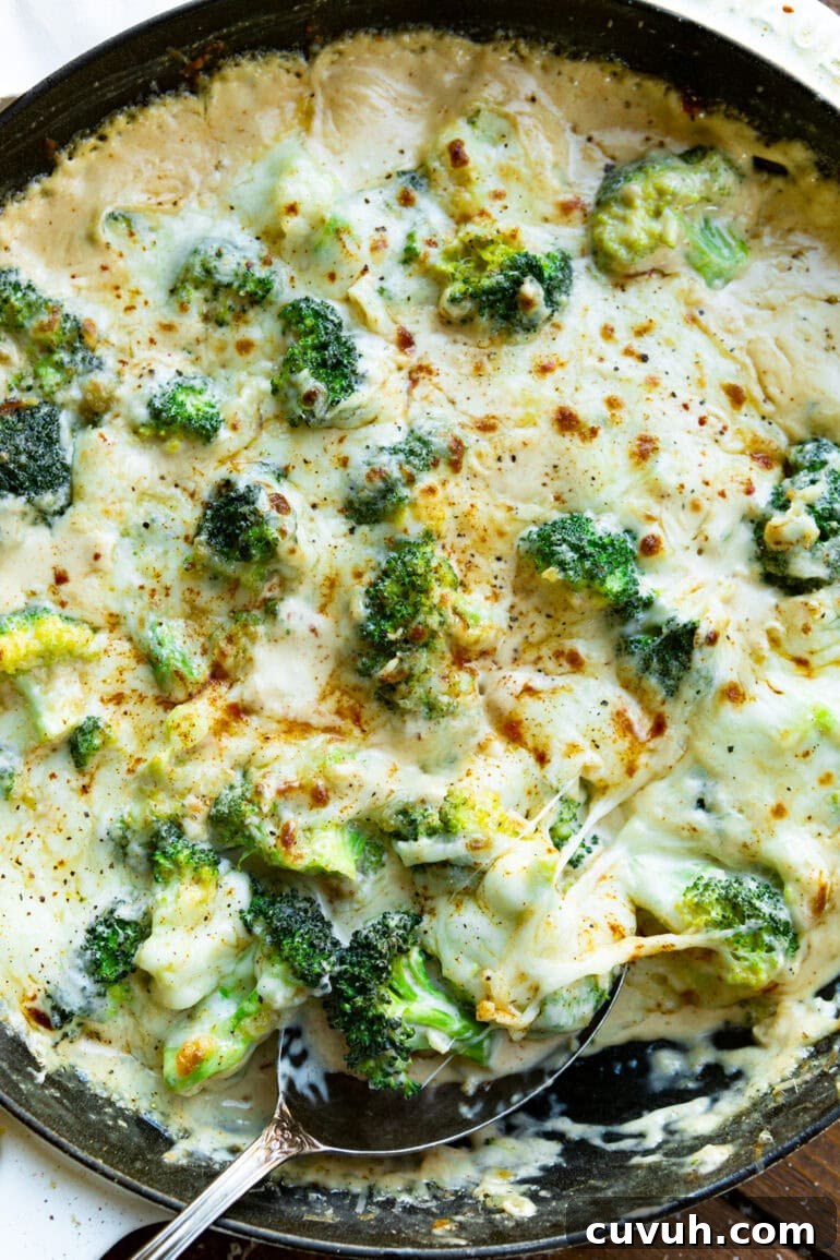 a photo of creamy parmesan garlic broccoli sprinkled with aleppo pepper