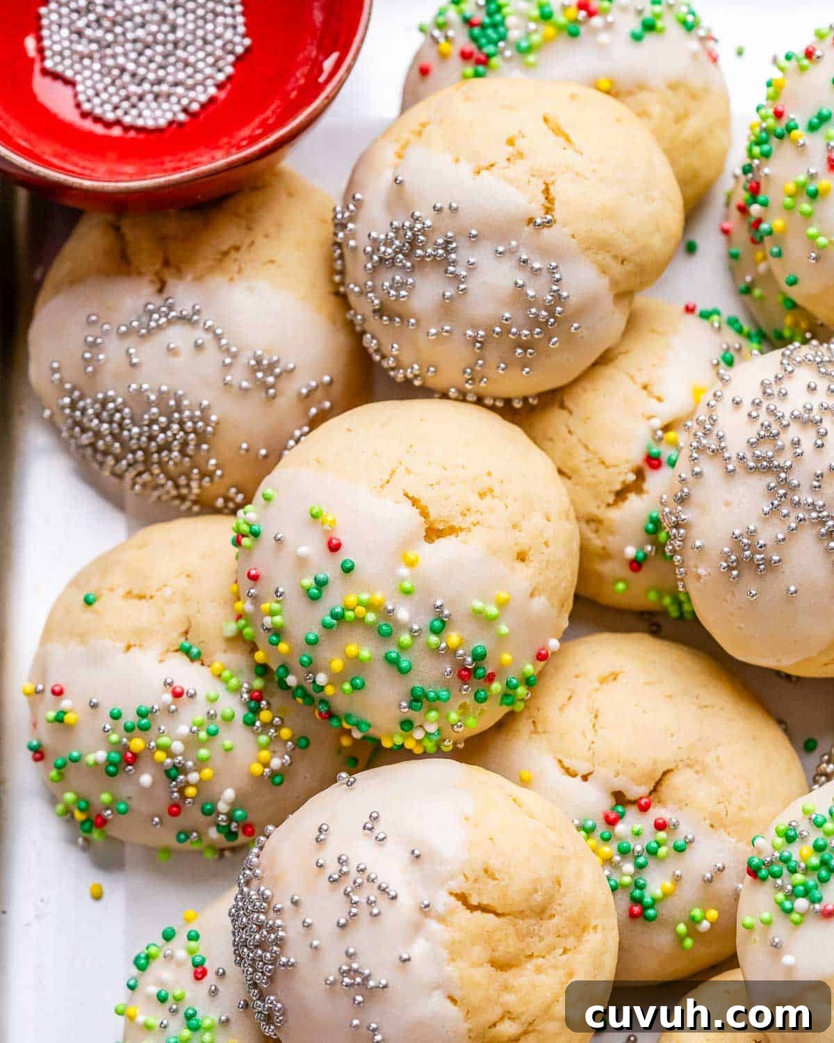 cookies with sprinkles on a sheet pan.