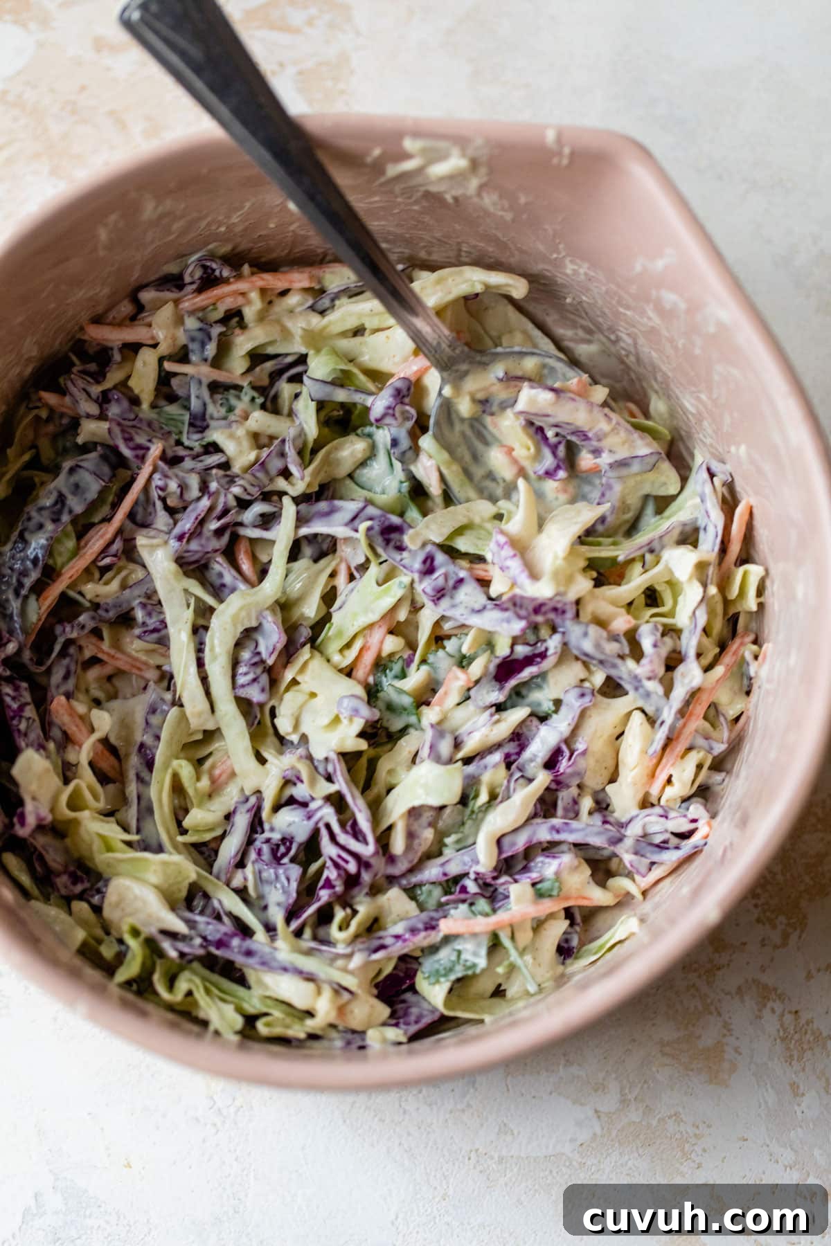 cabbage slaw in a large mixing bowl