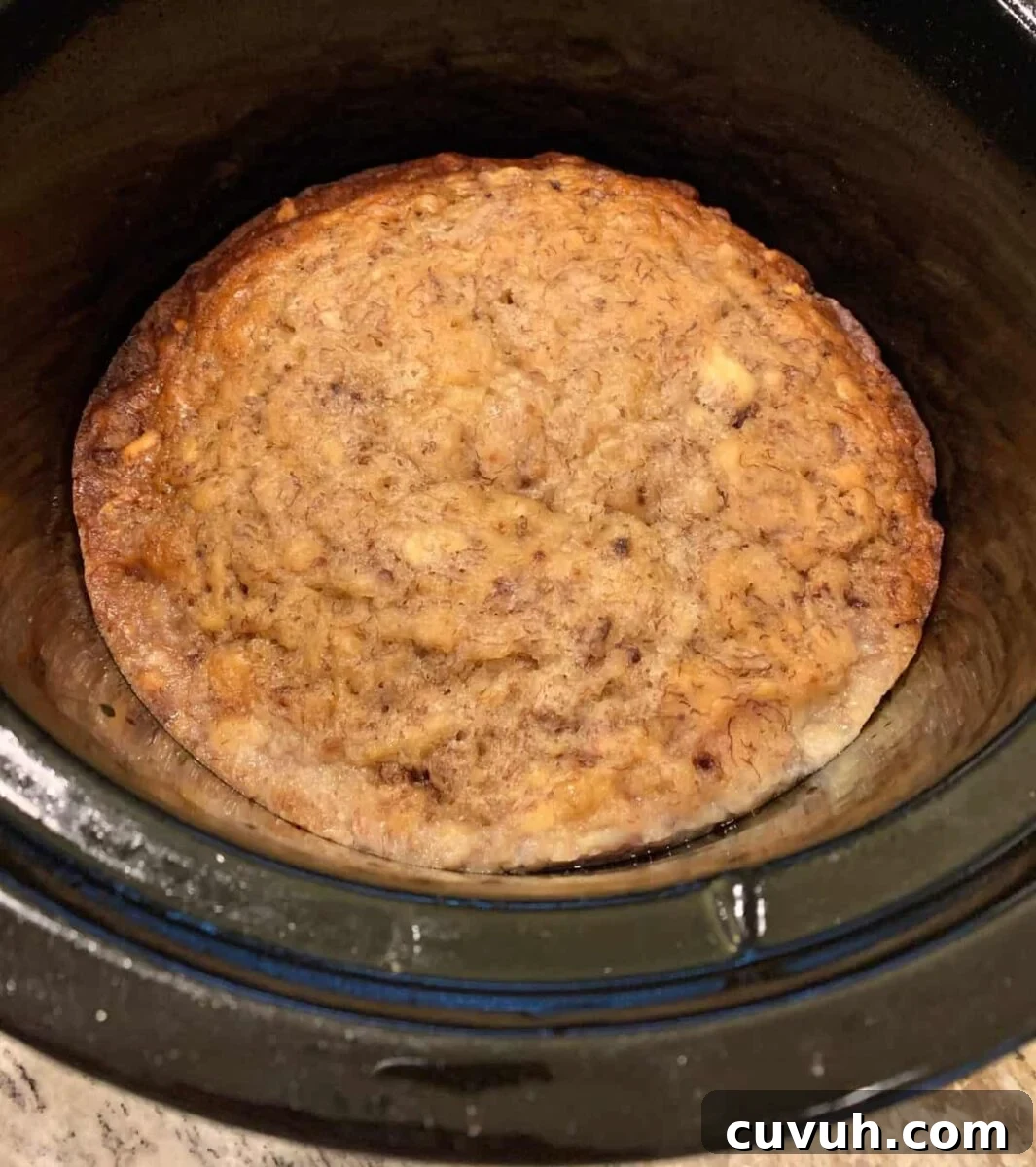 Banana bread baked in the bottom of the crockpot.