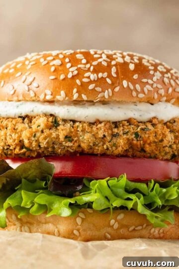 Air fryer chicken patty on a burger bun with toppings.