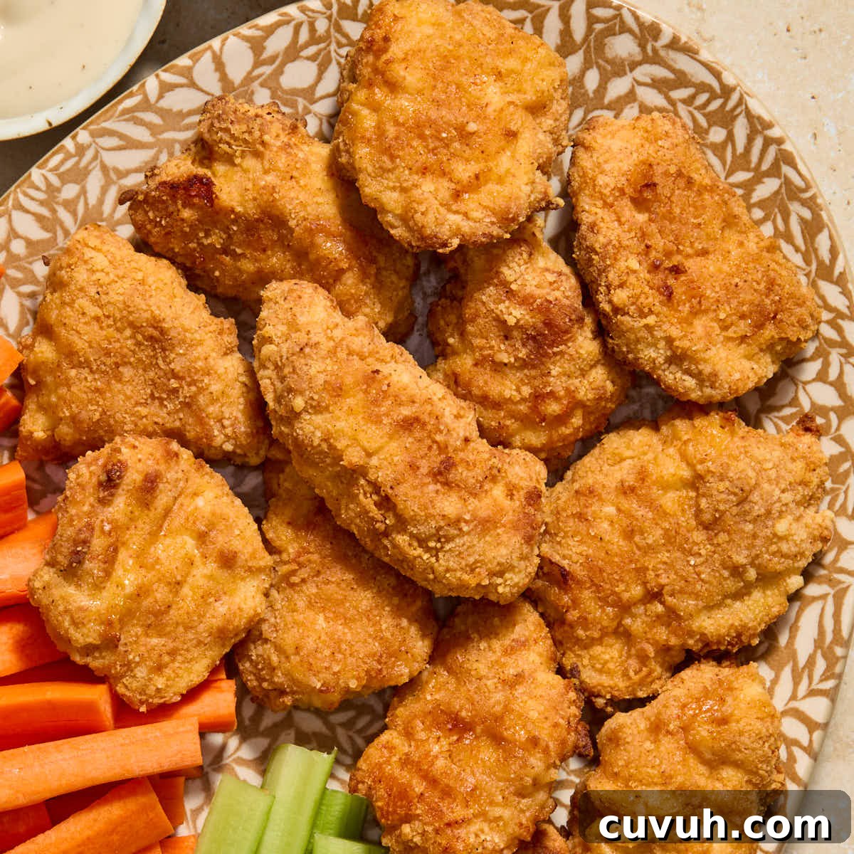 Crispy boneless chicken wings served on a platter.