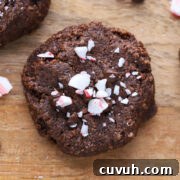 Double chocolate chip cookie on a cutting board.