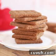 Stack of graham crackers on a white plate.