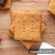 Small stack of graham crackers on a board.