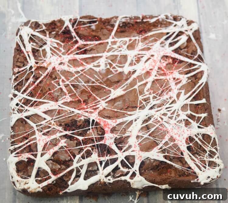 Here is the finished look for the Spider-Man Brownies with marshmallow Spider Webs all over the brownies.