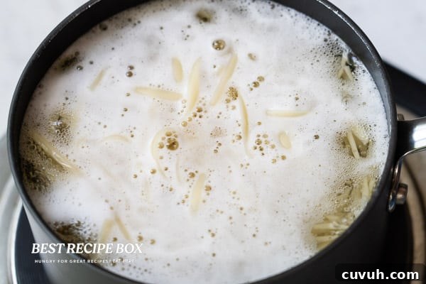 Noodles cooking in boiling water