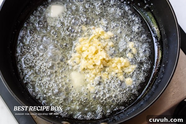 Butter and garlic cooking in pan