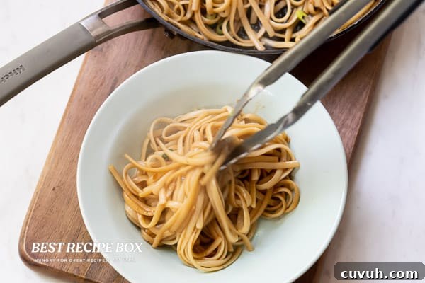 Plating noodles with tongs