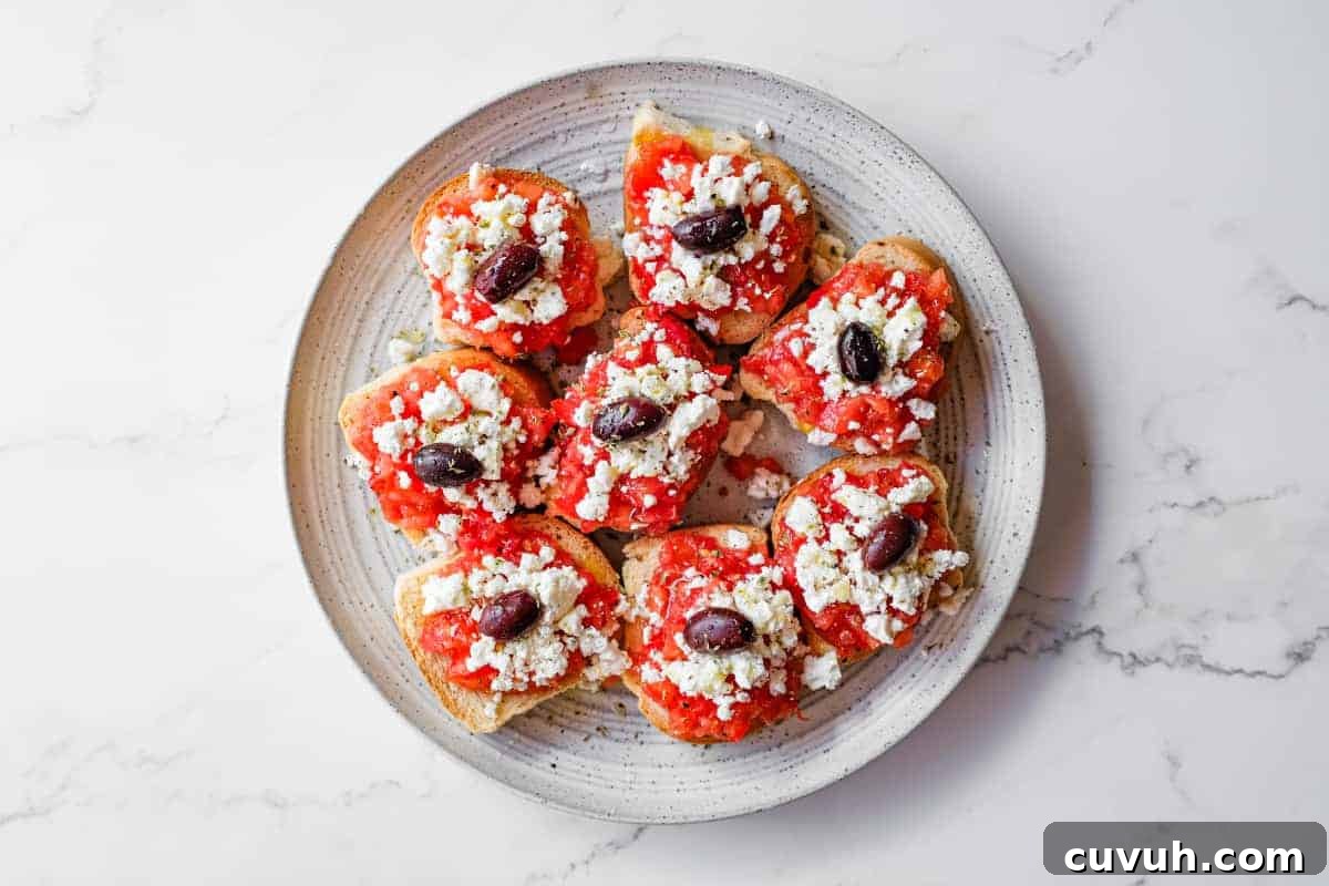 Simple Cretan tomato and feta rusks served as a Greek appetiser