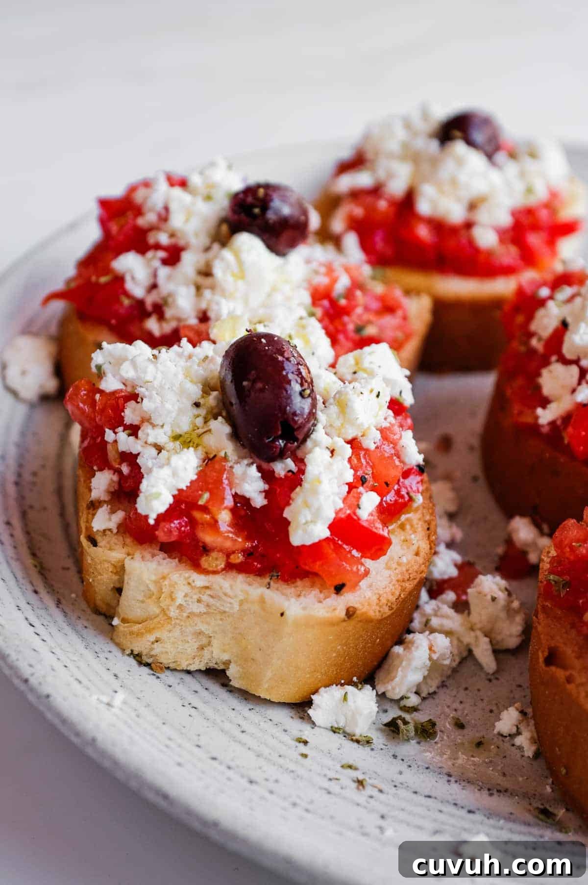 Traditional Greek dakos made with paximadia barley rusks and fresh tomato