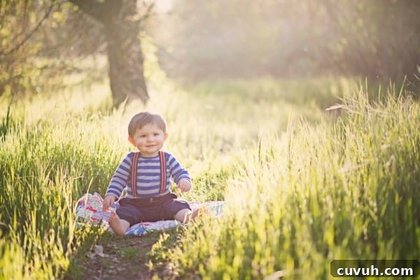 adorable toddler in a sunlit meadow.